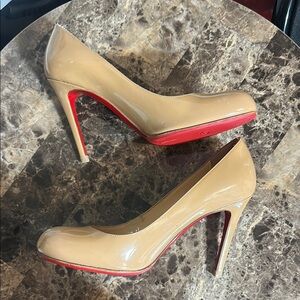 Christian Louboutin (100% Authentic) bottom protector was attached